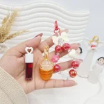 ست لیپ گلاس حرارتی عسل و تینت و دستبند برند APCKFLEE